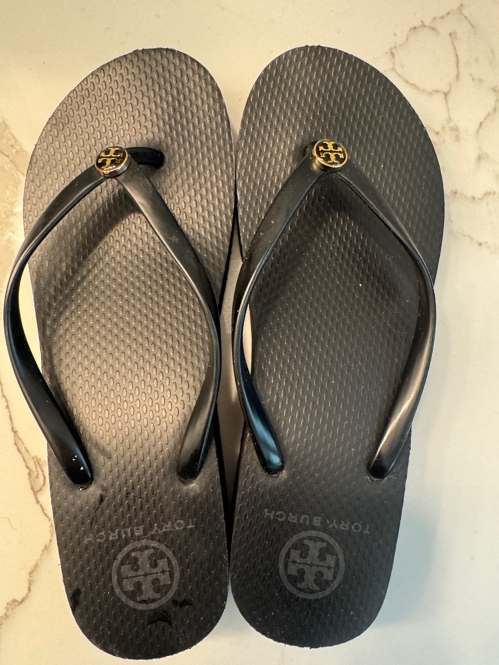 Tory Burch Black Flip Flop Sandals with Gold Logo Medallions